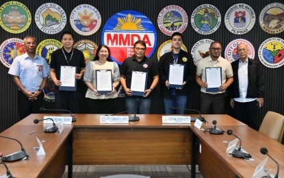 Metropolitan Manila Development Authority (MMDA) and local government executives pose for a photo with the newly signed memorandum of understanding (MOU) on traffic coordination and transport management along Marcos Highway at the MMDA headquarters in Pasig City on Wednesday (Aug. 26, 2026). Artes said the MOU seeks to establish a unified approach to addressing traffic congestion, road obstructions, and other traffic concerns along Marcos Highway, which traverses several jurisdictions. (Photo courtesy of MMDA)